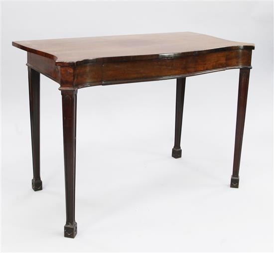 A George III mahogany serpentine shape side table, W.3ft 8in.